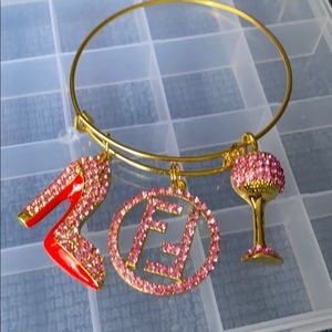 Gold plated bangle with charms